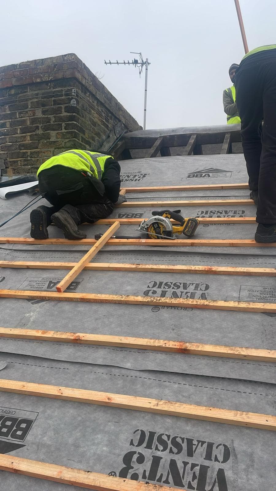 roofer working on roof