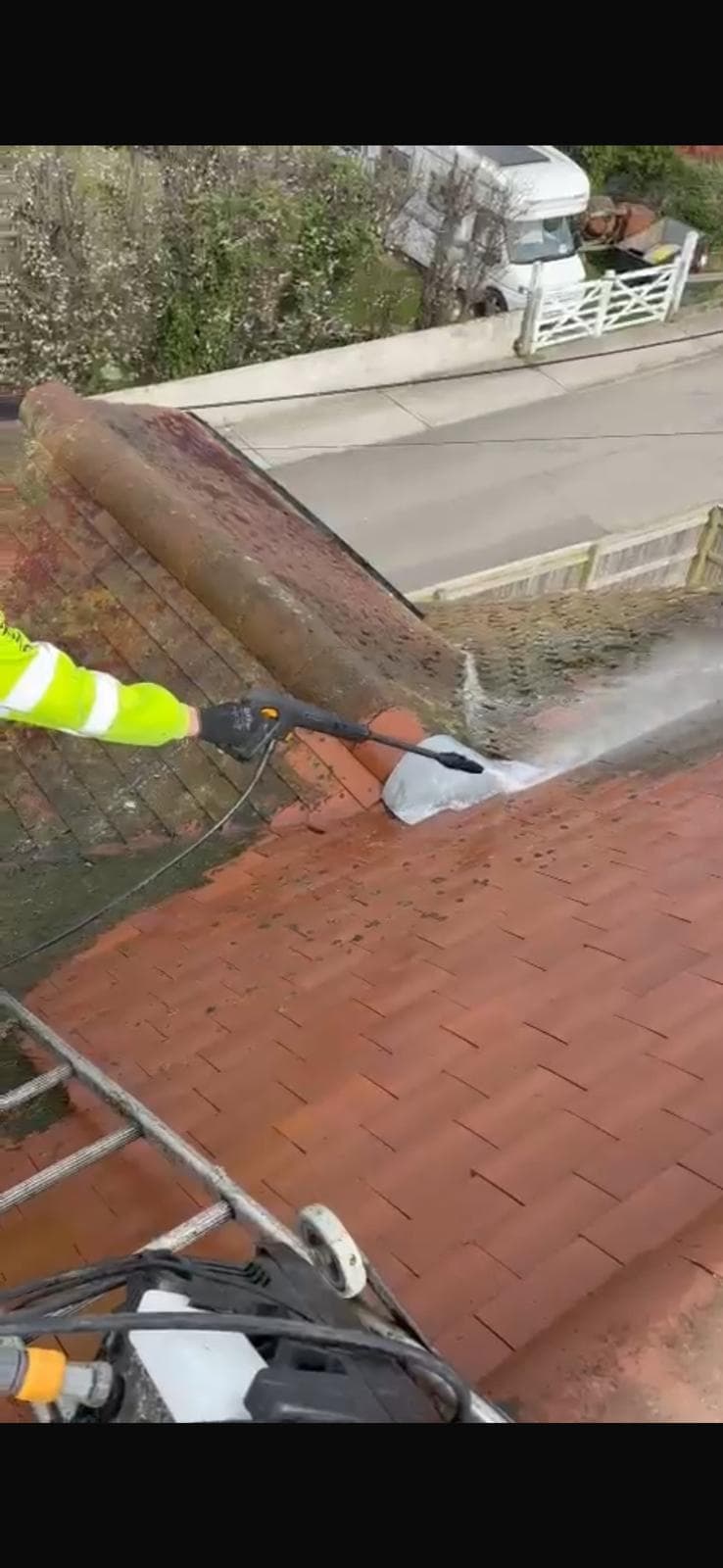 A roofer repointing brickwork on a job in Hythe