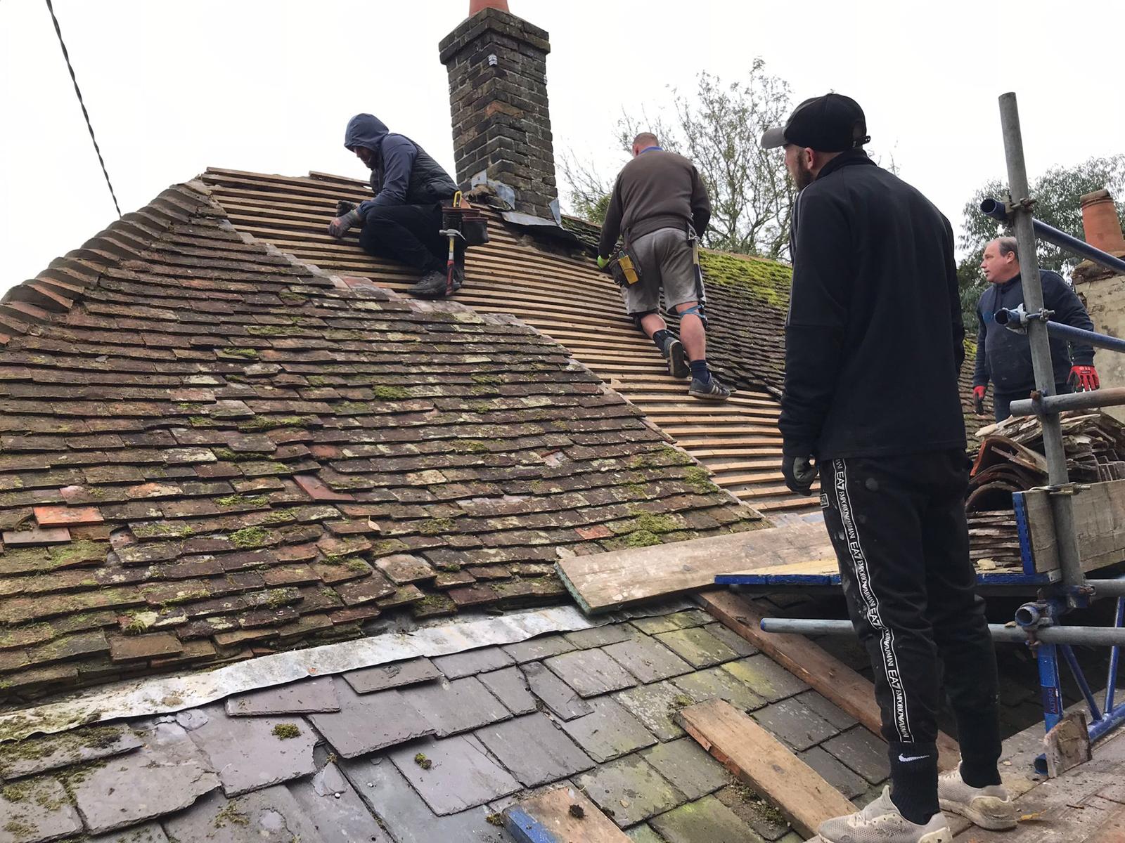 Roofers working on roof in Hythe